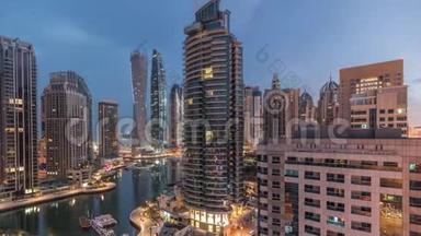 迪拜码头住宅和办公室摩天大楼的空中景观，海滨之夜到白天